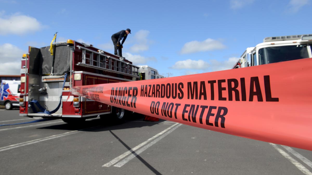 fire truck behind hazardous material warning tape during BayEx Full-Scale Exercise to test emergency response for CBRNE incidents