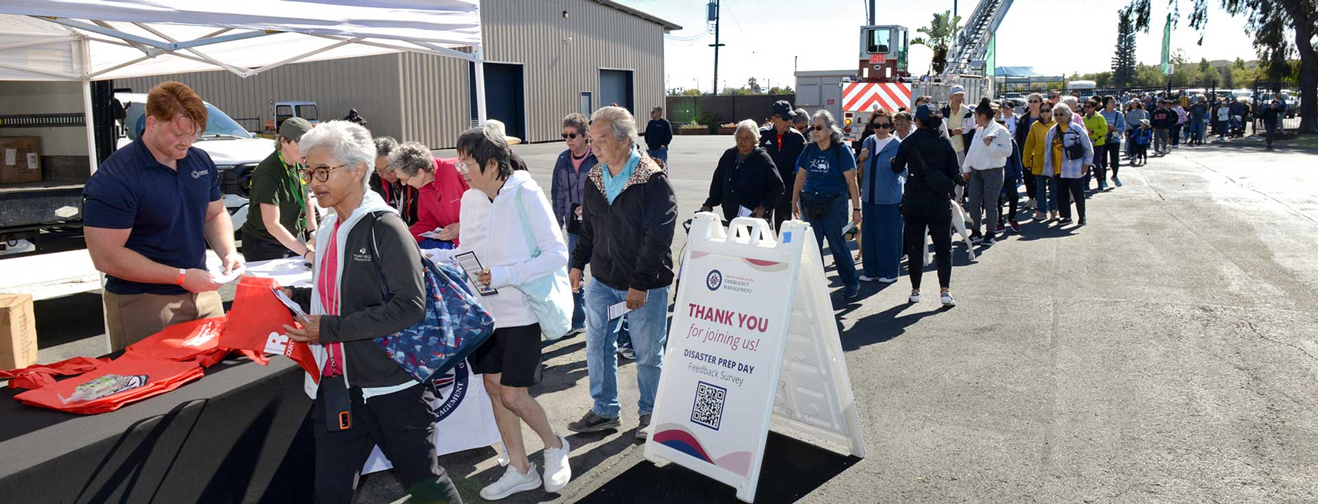 San Mateo County Emergency Management Disaster Preparedness Day event attendees wait in line for information and free resources