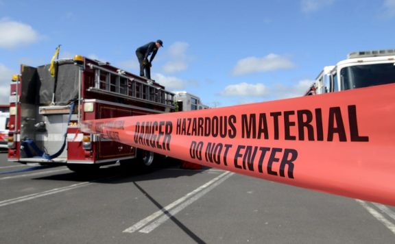 fire truck behind hazardous material warning tape during BayEx Full-Scale Exercise to test emergency response for CBRNE incidents