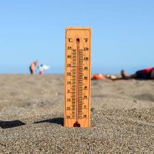 thermometer in hot beach sand